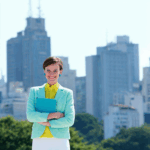 Four women in stylish pastel outfits, smiling in urban settings with cityscapes in the background.